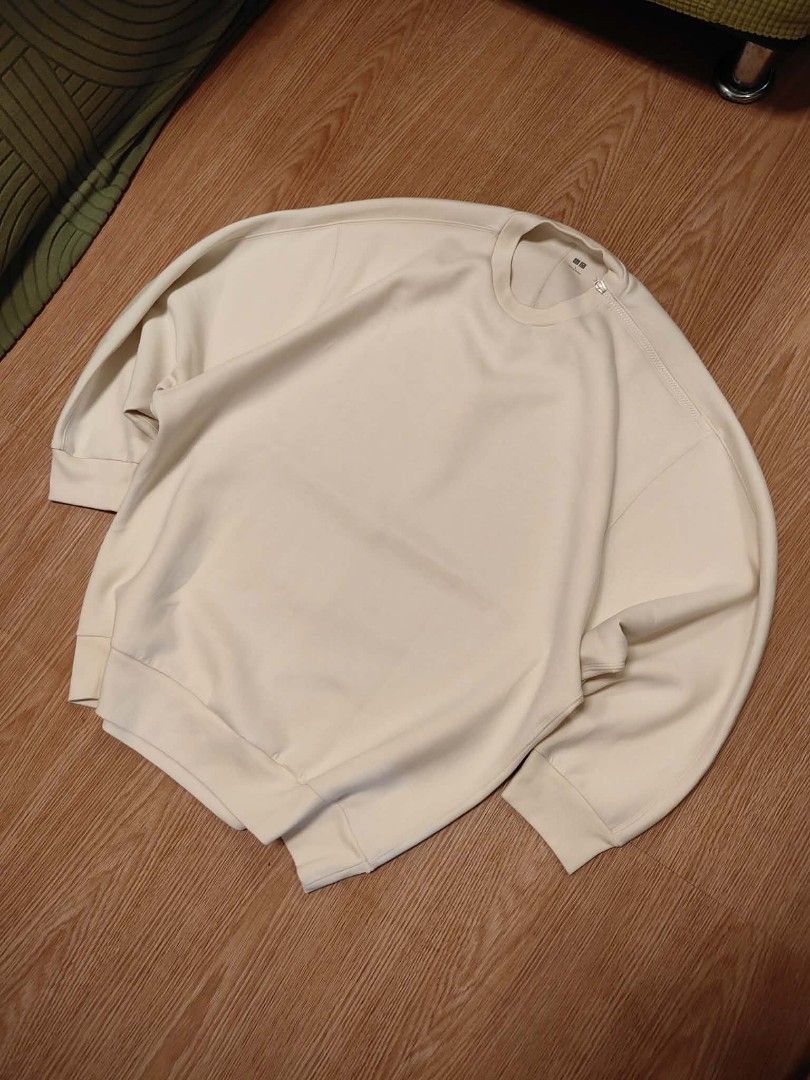 Uniqlo Beige Oversized Sweatshirt Size L (Category: Coats, Jackets and Outerwear) located in Muntinlupa City. Submitted by thegoodthriftph (Listing ID 1462792991, Image 1). Description: - Uniqlo Oversized Sweatshirt - Color: Light Beige - Style: Crewneck, Relaxed Fit - Features: Ribbed cuffs and hem - Origin: Made in Vietnam - Versatile: Great for casual wear and layering, easy to style..
