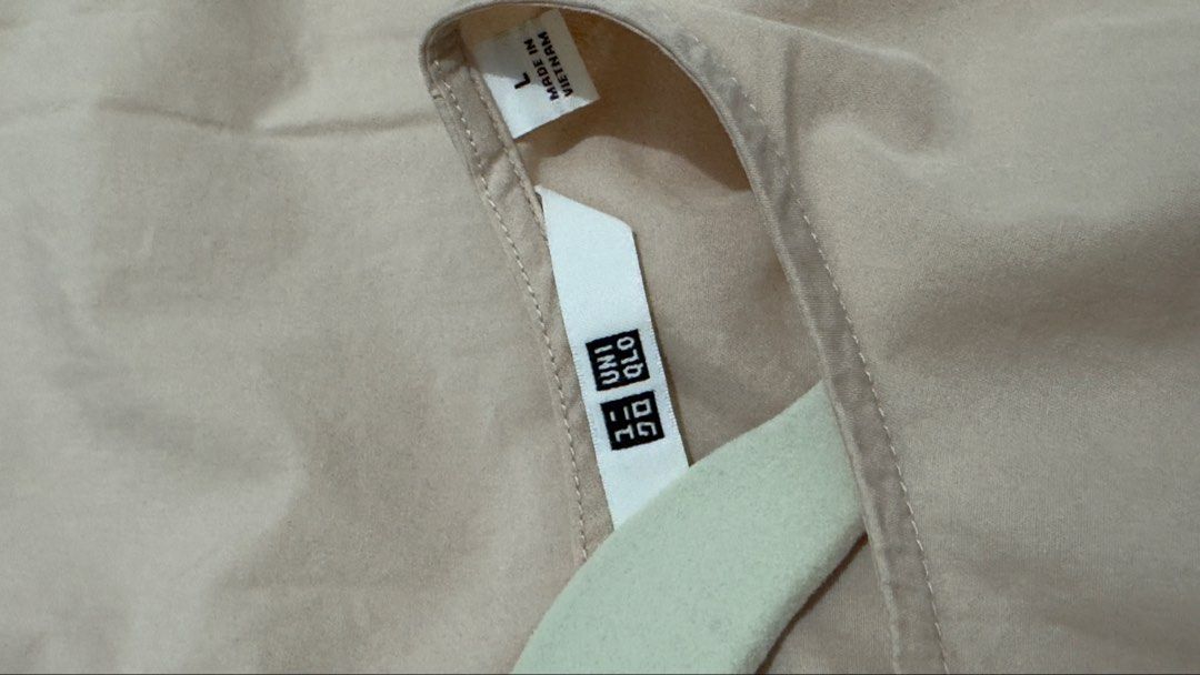 Uniqlo Beige Short Sleeve Button Back Top Size L (Category: Blouses) located in Quezon City. Submitted by heyhaveaniceday (Listing ID 1462845917, Image 3). Description: - Uniqlo beige short sleeve top - Size: L - Relaxed fit - Curved hem - Button-up back detail - Made in Vietnam.