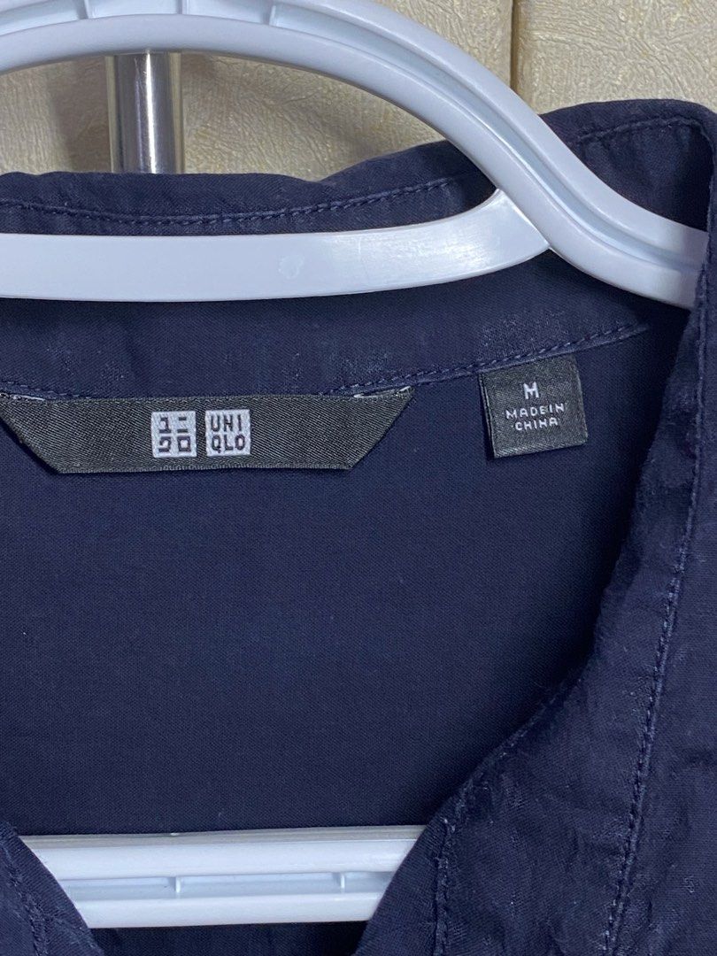 Uniqlo Long Sleeve Button Down Shirt Size M (Category: Tshirts & Polo Shirts ) located in Cagayan de Oro. Submitted by chewy.declutters (Listing ID 1462866981, Image 3). Description: - Uniqlo Long Sleeve Shirt - Color: Navy Blue - Style: Button-down with collar - Size: Medium (M) - Origin: Made in China - Versatile: Suitable for casual outings or work attire.