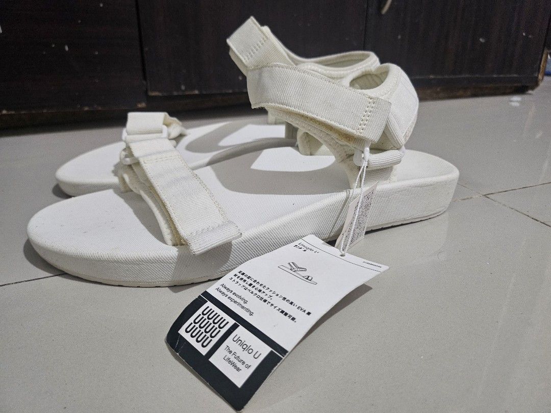 Uniqlo U White EVA Strap Sandals (Category: Slippers & Slides) located in Malabon City. Submitted by concepcionraymond1990 (Listing ID 1462740350, Image 2). Description: - Uniqlo U Sandals in White - High cushioning EVA material for comfort - Adjustable velcro strap closure - Versatile for everyday wear - Ideal for summer -US 9 - US 10 -Pickup Longos Malabon -P399 nalang bnew po yan never nasuot naaalikabukan lang sa bodega..