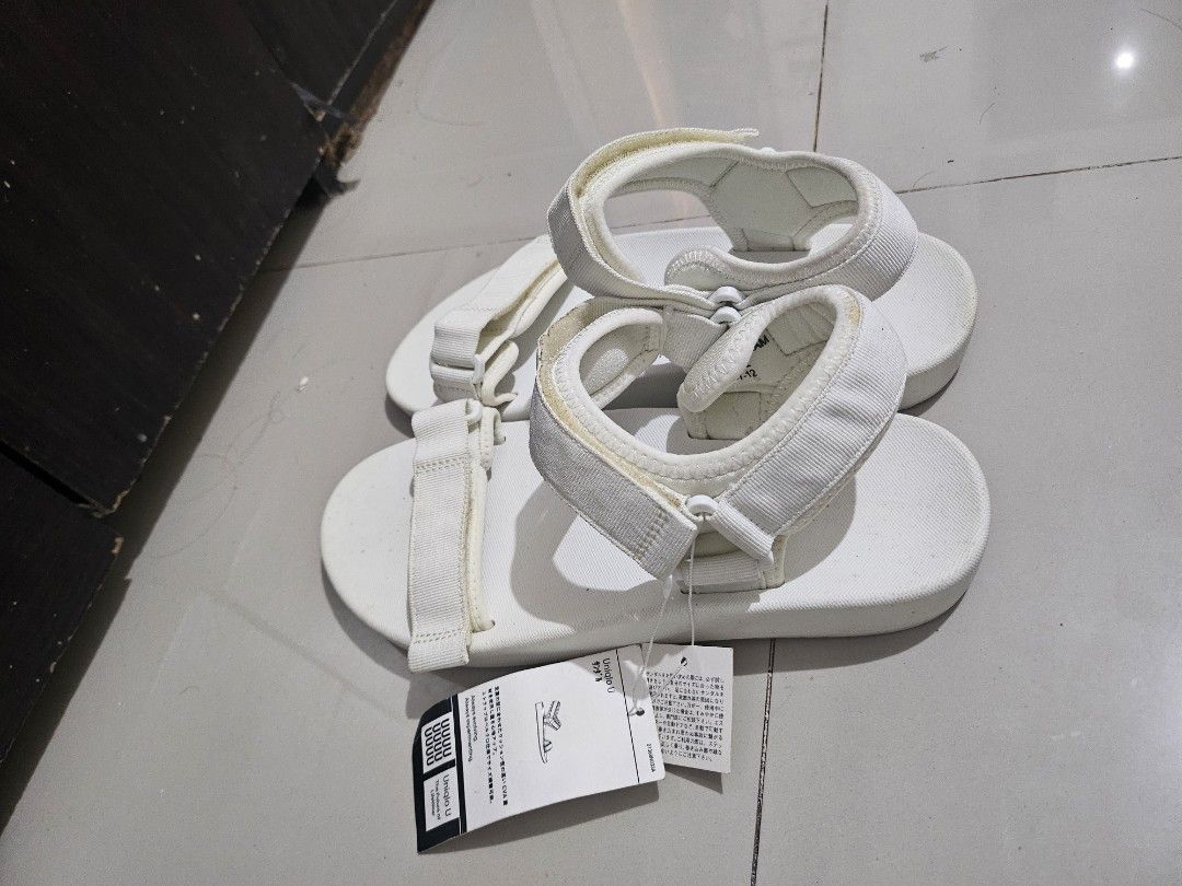 Uniqlo U White EVA Strap Sandals (Category: Slippers & Slides) located in Malabon City. Submitted by concepcionraymond1990 (Listing ID 1462740350, Image 1). Description: - Uniqlo U Sandals in White - High cushioning EVA material for comfort - Adjustable velcro strap closure - Versatile for everyday wear - Ideal for summer -US 9 - US 10 -Pickup Longos Malabon -P399 nalang bnew po yan never nasuot naaalikabukan lang sa bodega..