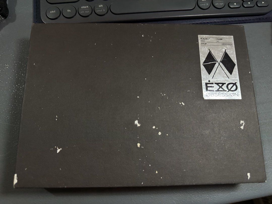 Unsealed EXO 6th Album Obsession (Category: K-Wave Merchandise) located in Jagna. Submitted by caraxes_brightflame (Listing ID 1462766682, Image 3). Description: Inclusions: - CD + lyric book - complete members photobooks (6) - box cover (with slight white patches pls see pics) - w/ sticker freebie (fan made) RFS: decluttering & quitting album collection .