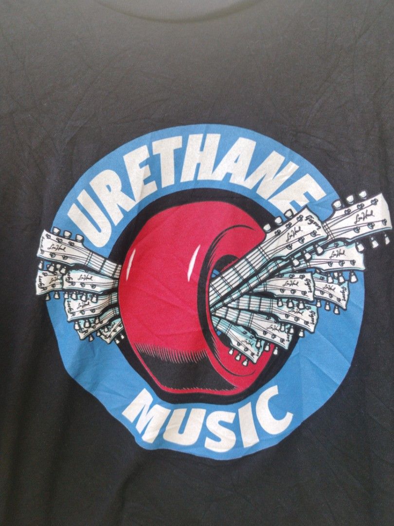 Urethane Music (Category: Tshirts & Polo Shirts ) located in Legazpi City. Submitted by genobecollectives (Listing ID 1462697767, Image 2). Description: - Black Urethane Music graphic t-shirt - Features a cool circular logo with guitars and a red accent - Short sleeves and classic crew neck - Ideal for everyday casual wear -22 x 30 very good condition dm📩.