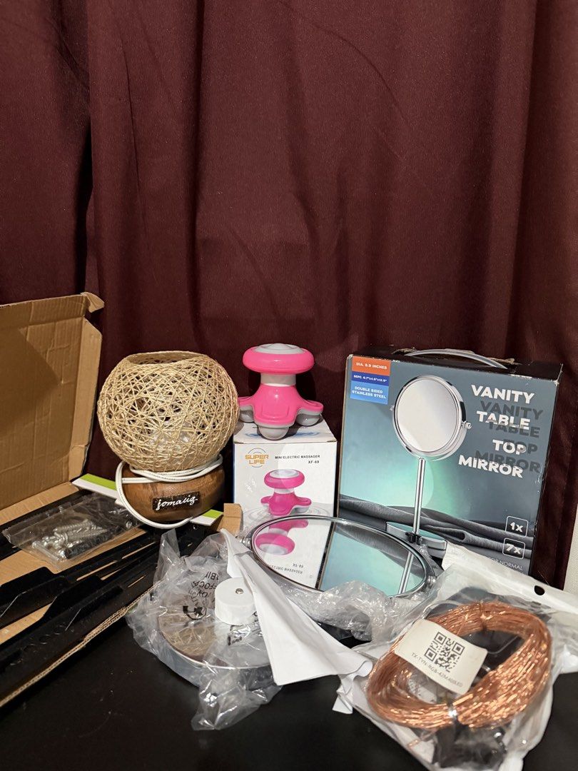 Vanity Mirror, Mini Massager, String Lights & More (Category: Mirrors) located in Caloocan City. Submitted by rohllee (Listing ID 1462729595, Image 1). Description: - XL Vanity Table Top Mirror - Pink Mini Electric Massager - Decorative Woven Ball Lamp with Wooden Base (no bulb) - Copper Wire LED String Lights with Solar Panel (good working condition) - Tv Bracket - Ideal for personal use or as a thoughtful gift.