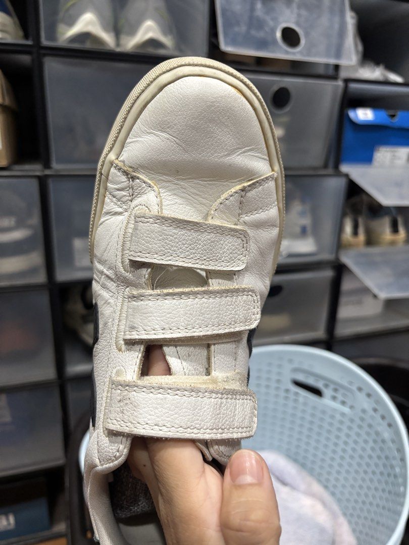 Veja White Leather Velcro Sneakers (Category: Sneakers) located in Tarlac. Submitted by shoplalanow (Listing ID 1462798583, Image 1). Description: - White leather Veja sneakers - Black accent details - Three velcro straps for easy wear - 'VEJA' logo on heel and side - Ideal for everyday use.
