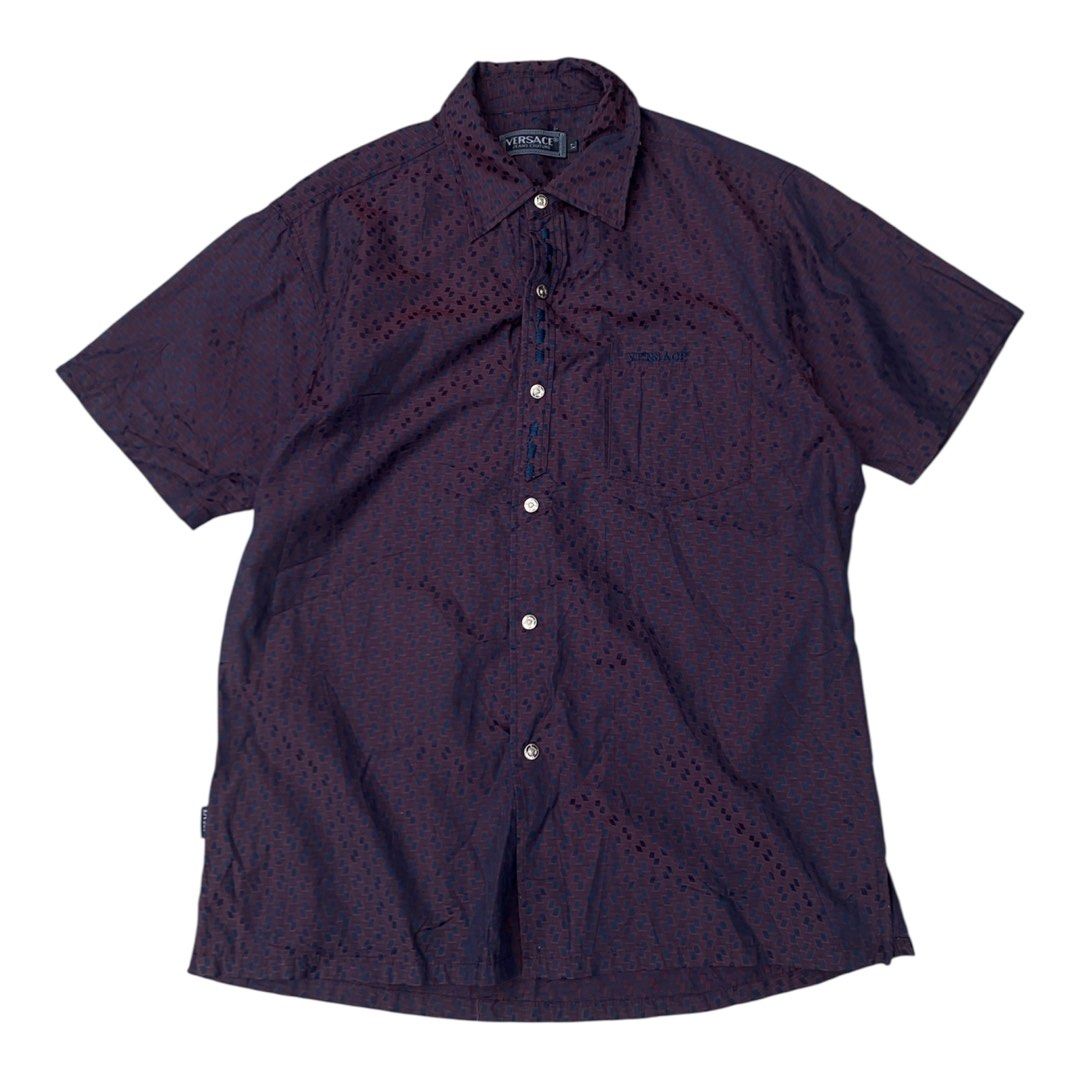 Versace Short Sleeve Button Up Shirt (Category: Tshirts & Polo Shirts ) located in Bacolod City. Submitted by unkemptrags (Listing ID 1462844649, Image 1). Description: - Versace Short Sleeve Button down - Color: Burgundy with Dark Blue Geometric Pattern - w21.5 l28.5 - Features: Chest Pocket, Button Closure - Origin: Made in Italy - Style: Ideal for Night Out or Casual Wear.
