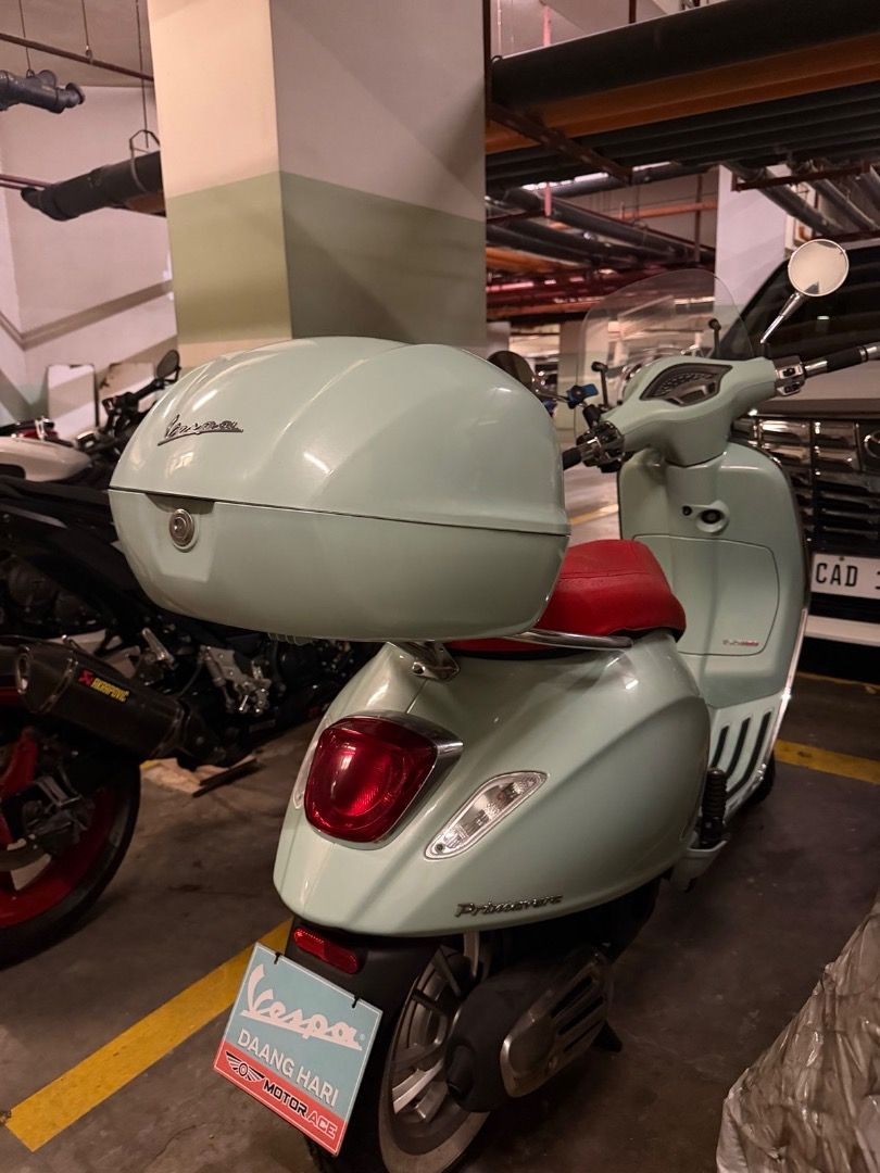 Vespa Primavera Scooter with Top Box (Category: Motorbikes for Sale) located in Caloocan City. Submitted by cg031 (Listing ID 1462788221, Image 1). Description: Light blue Vespa Primavera scooter. Comes with a matching top box and a red seat. Has a windscreen. Ready for your next ride. Great for city commuting..