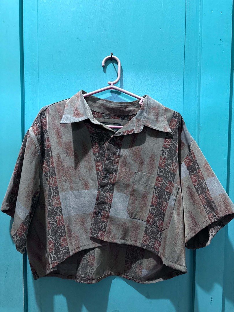 Vintage Abstract Print Cropped Button-Up Shirt (Category: Shirts) located in Cabuyao City. Submitted by dumbonita (Listing ID 1462837673, Image 1). Description: - Vintage cropped shirt - Abstract print in muted greens, grays, and reds - Short sleeves - Collar - Single chest pocket - Relaxed fit - Perfect for a retro look.