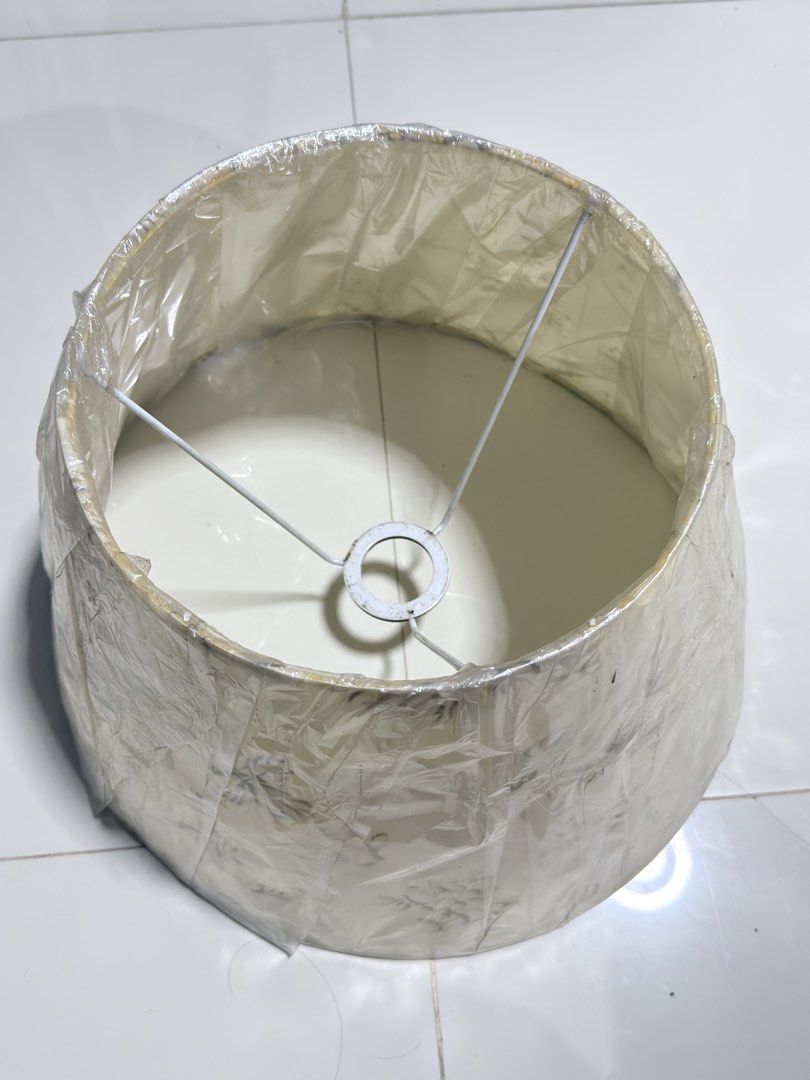Vintage Floral Lampshade (Category: Lighting) located in Paranaque City. Submitted by thousandfold (Listing ID 1462695457, Image 2). Description: Sale swap to catfood for strays - Cream-colored lampshade with a delicate floral pattern. - Slightly textured fabric finish. - Standard fitting, suitable for table or floor lamps. - Approximate dimensions: 8 inches height, 10 inches diameter. - Adds a classic touch to any room..
