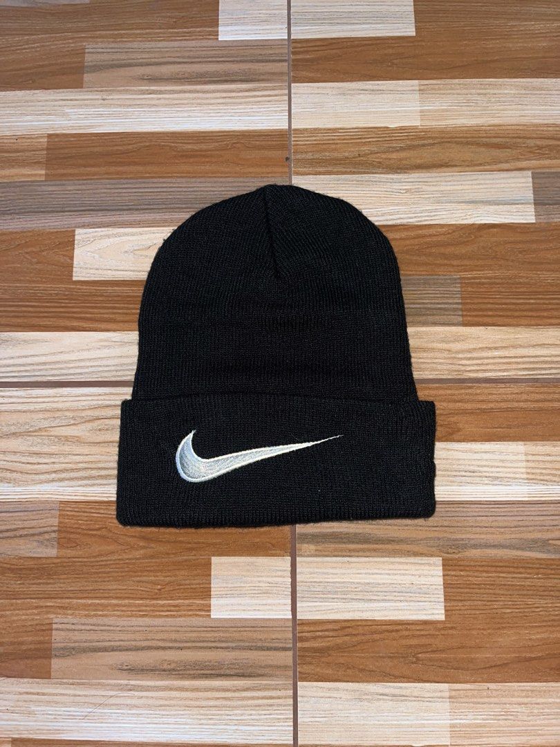 Vintage Nike Black Acrylic Beanie Hat (Category: Caps & Hats) located in Nabua. Submitted by lastthrift2.0 (Listing ID 1462842885, Image 1). Description: - Brand: Nike - Color: Black - Material: 100% Acrylic - Size: Adult One Size Fits All - Care Instructions: Machine wash warm with colors, line dry, do not iron - Origin: Made in the Philippines - Benefit: Great for keeping warm.