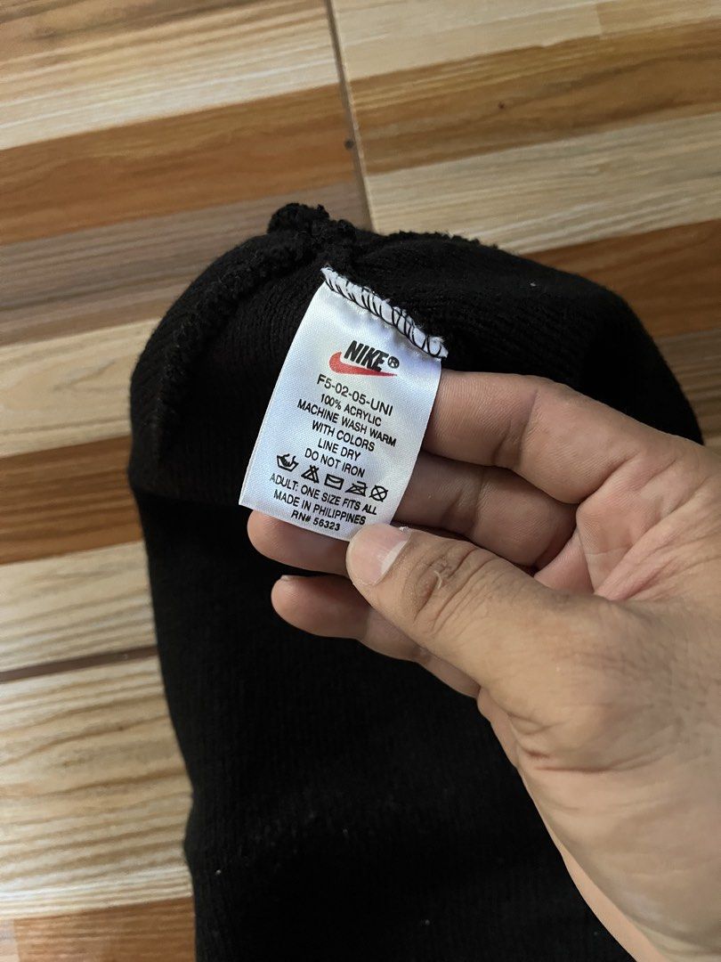 Vintage Nike Black Acrylic Beanie Hat (Category: Caps & Hats) located in Nabua. Submitted by lastthrift2.0 (Listing ID 1462842885, Image 2). Description: - Brand: Nike - Color: Black - Material: 100% Acrylic - Size: Adult One Size Fits All - Care Instructions: Machine wash warm with colors, line dry, do not iron - Origin: Made in the Philippines - Benefit: Great for keeping warm.
