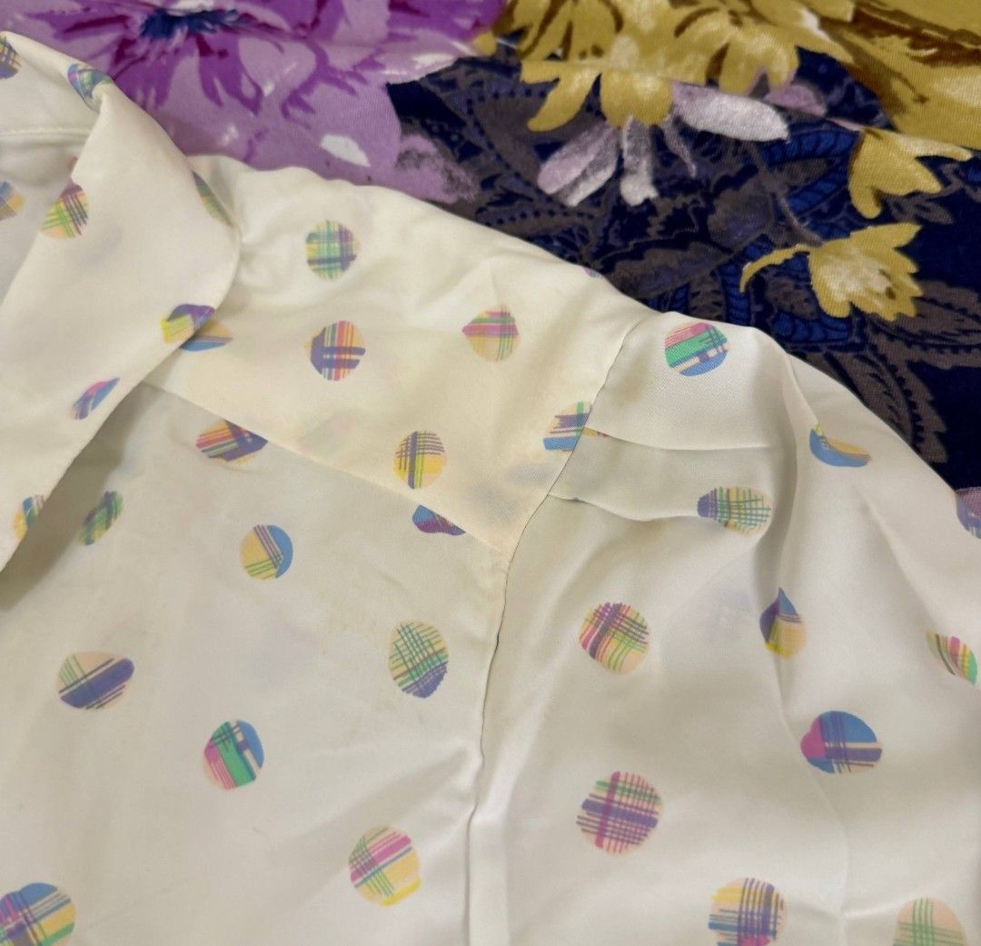 vintage white polka dot long sleeve button up blouse (Category: Blouses) located in Manila. Submitted by laurloopsy (Listing ID 1462696983, Image 3). Description: - fits size S to M - white long sleeve blouse - features a colorful polka dot pattern - cuffs have subtle patterned trim - versatile for casual wear or layering issue: has small yellowish stains, needs washing.