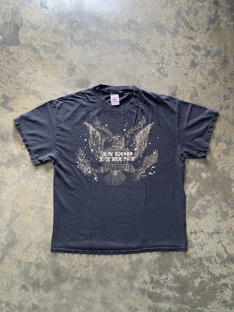 VTG Jesus Tee “ In God I Trust” (Category: Tshirts & Polo Shirts ) located in Cebu City. Submitted by kingzki032 (Listing ID 1462837646, Image 2). Description: Size : Large Tennessee River Tag Dimes : 21x26 Condition : Right Penhole.