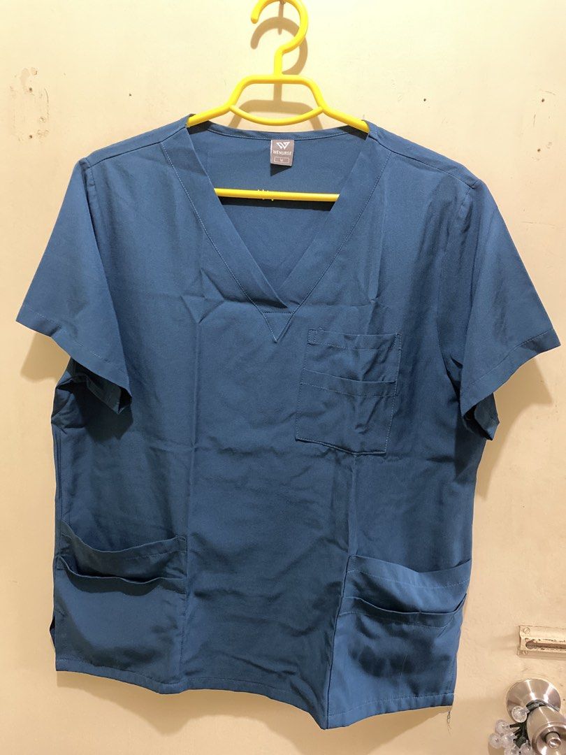 Teal Scrub Suit Top and Pants Set - Size M (Category: Sets or Coordinates) located in Pasig City. Submitted by alaineeeee (Listing ID 1462774700, Image 1). Description: - Teal scrub set (top and pants) from WENURSE - Size: Medium - Top features a V-neck and multiple pockets - Pants have an elastic waistband with a drawstring and side pockets - Comfortable and practical for everyday wear - Selling as a complete set.