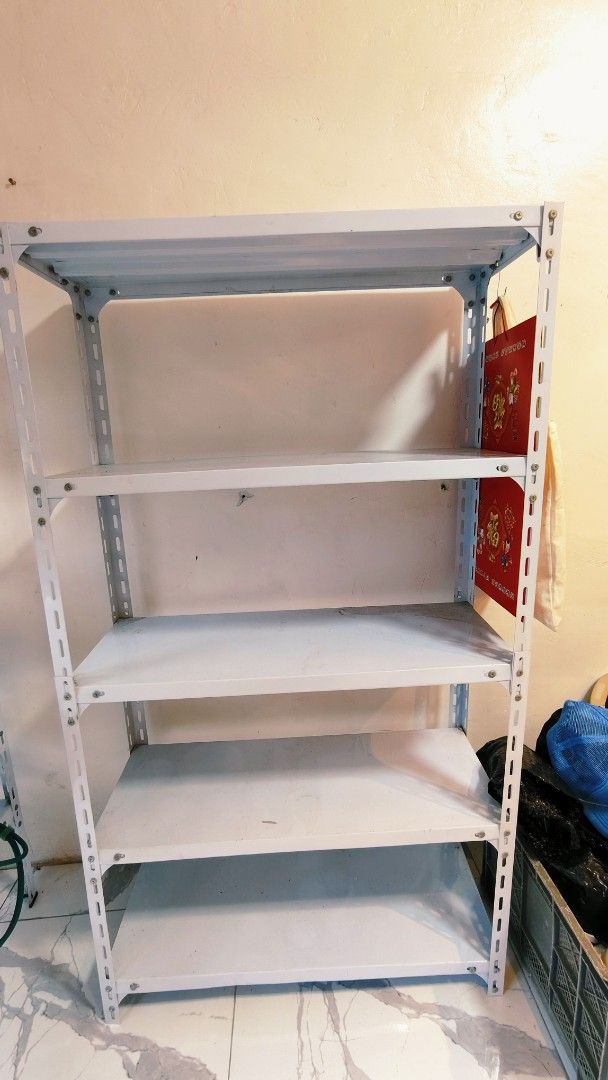 White 5-Tier Metal Shelving Unit Storage Rack (Category: Shelves, Cabinets & Racks) located in Bulacan. Submitted by babz30261 (Listing ID 1462881068, Image 2). Description: - Sturdy white metal shelving unit - 5 tiers for ample storage - Ideal for home or garage organization - Easy to assemble - Pick up only.