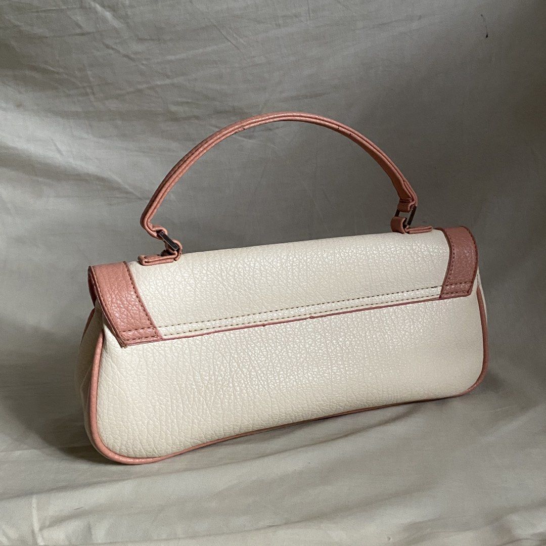 White and Pink Bow Rectangular Vintage Leather Handbag (Category: Luxury Bags & Wallets) located in Manila. Submitted by yannaapril (Listing ID 1462742842, Image 3). Description: Clean and high quality leather material, cute y2k whimsical | with free twilly - Adorable white handbag with charming pink trim and bow detail. - Features a single handle for easy carrying. - Secure flap closure to keep your belongings safe. - Compact size, ideal for ess