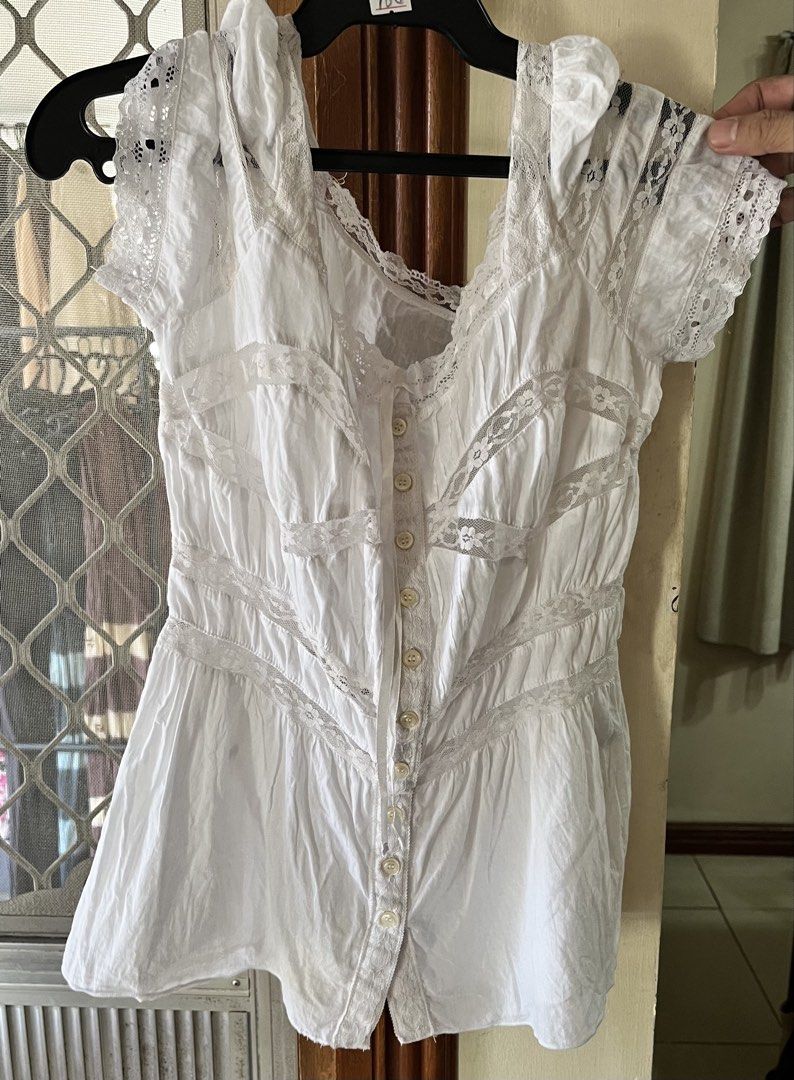 White blouse (Category: Blouses) located in Bacoor. Submitted by ayit. (Listing ID 1462719149, Image 1). Description: - White blouse - Japanese brand - Size: S (EU 36 / UK 8 / US 4) - Features delicate lace accents on sleeves and neckline - Button-down front closure.