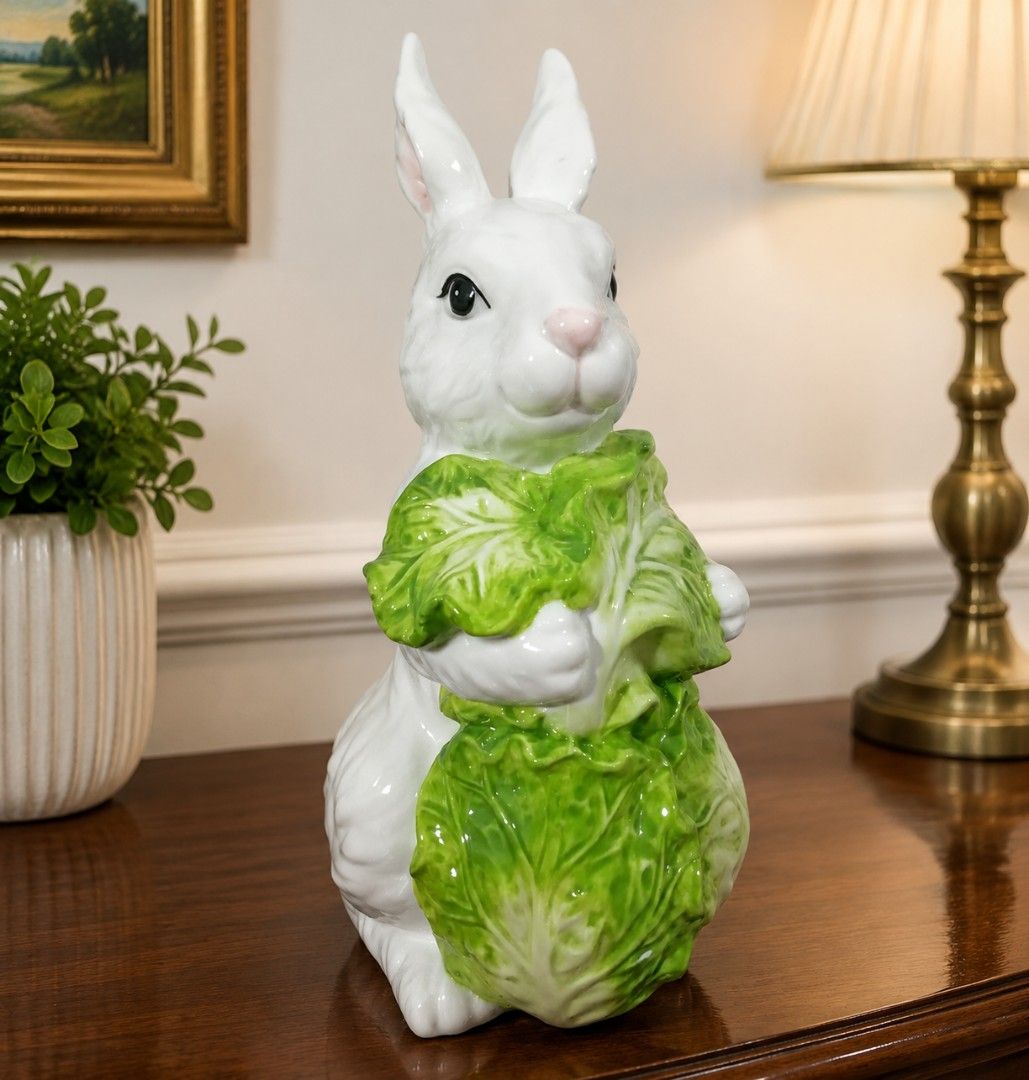 White Ceramic Bunny Holding Lettuce Figurine Easter Decor (Category: Other Home Decor) located in Caloocan City. Submitted by jeicee858582831 (Listing ID 1462859029, Image 3). Description: - Adorable white ceramic bunny figurine - Holding a detailed, vibrant green head of lettuce - Features a fluffy texture on its back and tail - Ideal for Easter decorations - Adds a charming accent to any shelf or table.