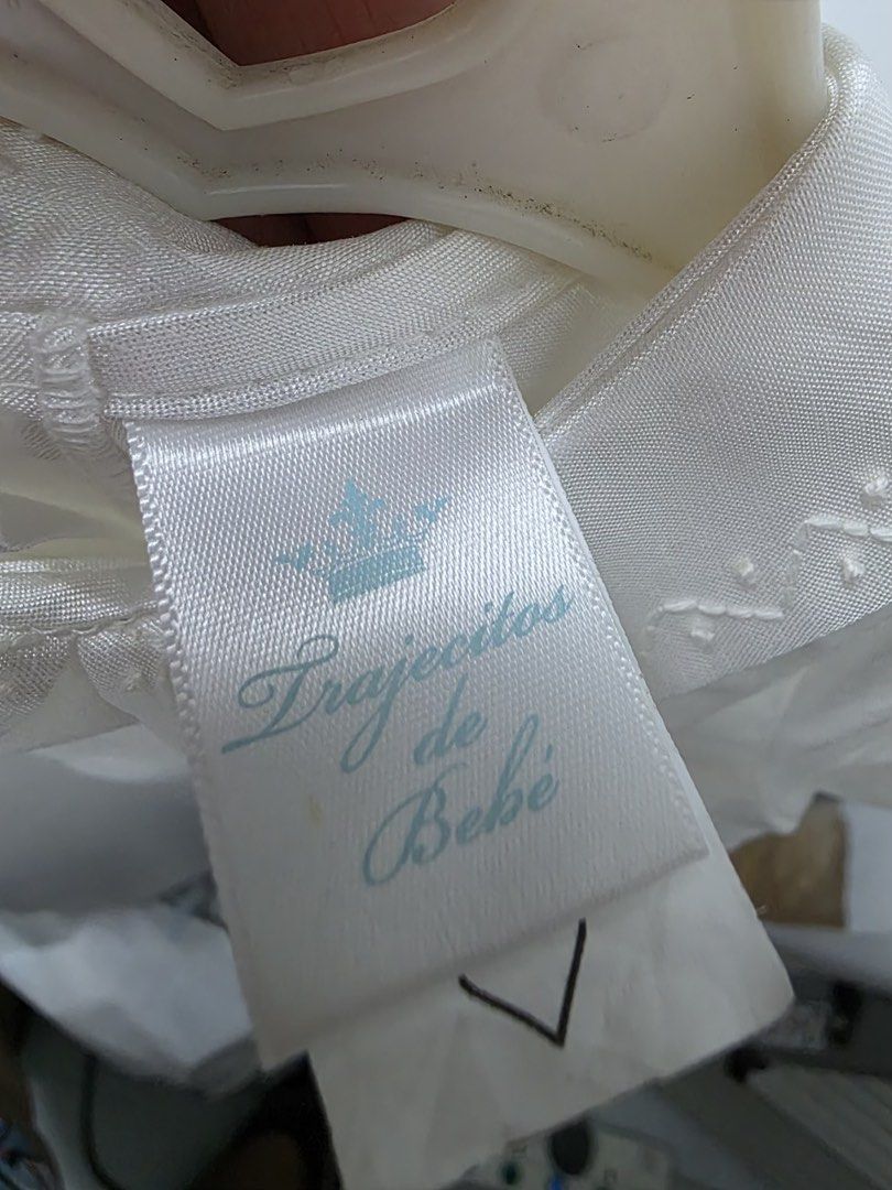 White Christening Gown Handmade Philippines (Category: Babies & Kids Fashion) located in Paranaque City. Submitted by stamford.woodleigh (Listing ID 1462773579, Image 3). Description: - White christening gown from Trajectos de Bebe - Handmade in the Philippines - Material: 100% Polyester - Tag Size: Approx. 6 months / 68cm height - Features: Short sleeves, Peter Pan collar, button front closure - Beautiful detailing on collar and bodice.