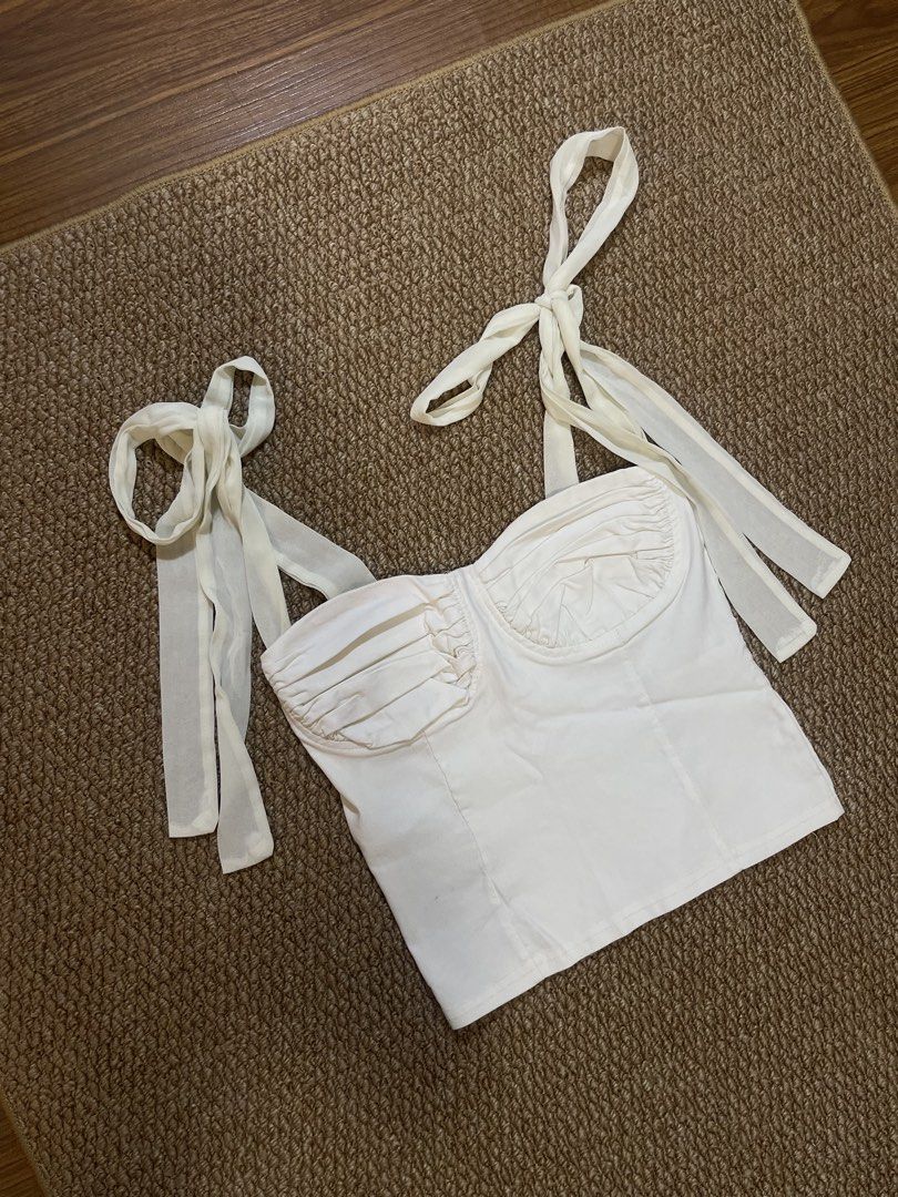 White Corset Bustier Top with Tie Straps (Category: Sleeveless) located in Pasig City. Submitted by miafml-closet-cleanout (Listing ID 1462806540, Image 2). Description: posted price is fixed ♡ will not respond to hagglers. 💵 mop: gcash / bdo / maribank / unionbank 🛵 courier: any as long as arranged by buyer 🙅🏻‍♀️ no requested worn photos ❌ no meet-ups.