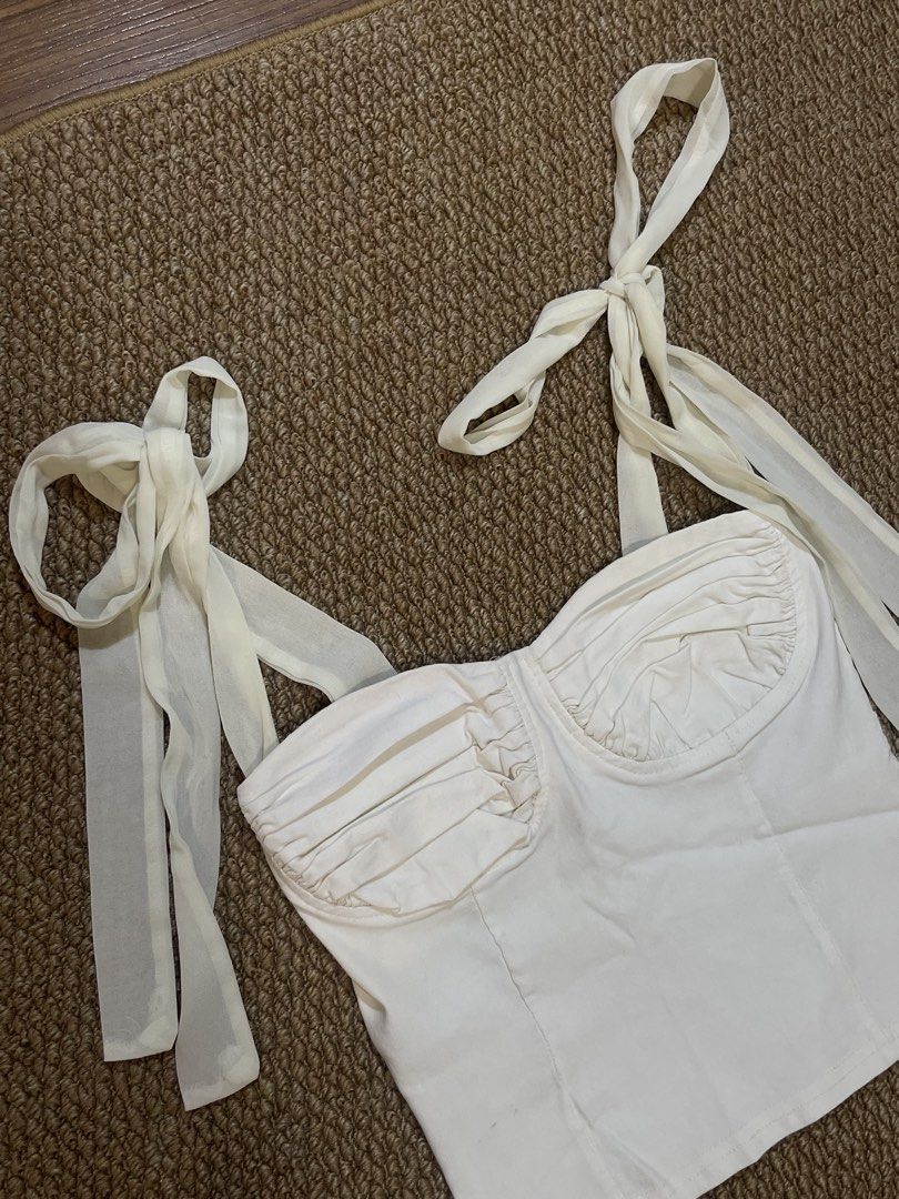 White Corset Bustier Top with Tie Straps (Category: Sleeveless) located in Pasig City. Submitted by miafml-closet-cleanout (Listing ID 1462806540, Image 1). Description: posted price is fixed ♡ will not respond to hagglers. 💵 mop: gcash / bdo / maribank / unionbank 🛵 courier: any as long as arranged by buyer 🙅🏻‍♀️ no requested worn photos ❌ no meet-ups.