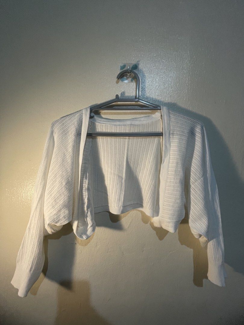 White Cropped Knit Cardigan (Category: Coats, Jackets and Outerwear) located in Manila. Submitted by sammmm777 (Listing ID 1462800299, Image 1). Description: - White cropped knit cardigan - Perfect for layering over tops or dresses and beach outfits - Ideal for casual or slightly dressed-up outfits.