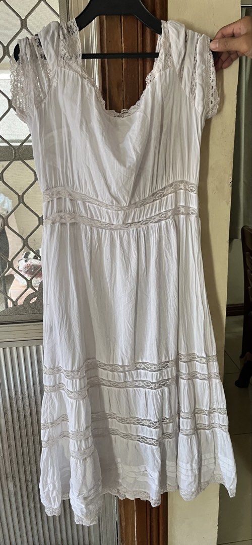 White dress (Category: Dresses) located in Bacoor. Submitted by ayit. (Listing ID 1462716858, Image 2). Description: - White dress from a Japan brand - Size: Medium (EU 38/UK 10/US 6) - Features delicate lace accents on sleeves and hem - Button-down front design - Condition: 4/5 (excellent) - Perfect for casual or semi-formal occasions - Meetup available in Citta Italia Subdivision, Molino V, Bacoor, Cavite.