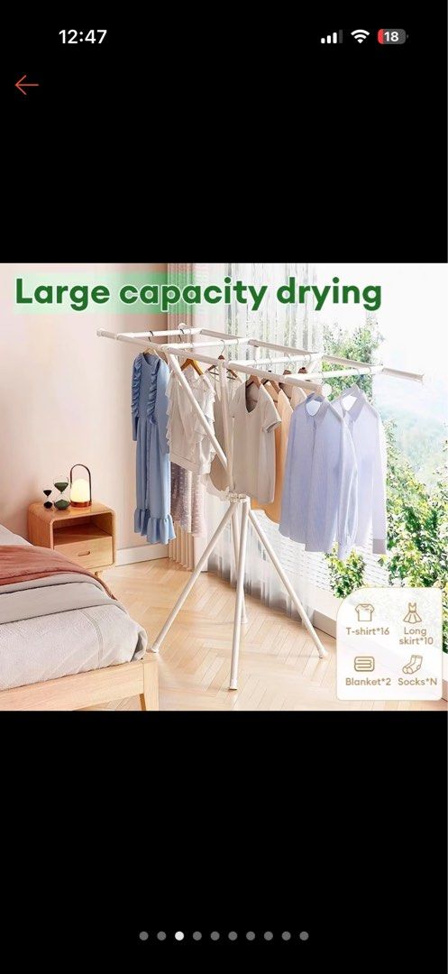 White Foldable Drying Rack for Clothes (Category: Clothes Drying Rack) located in Makati City. Submitted by ria_cat (Listing ID 1462868519, Image 3). Description: - White foldable drying rack - Multiple bars for hanging clothes - Ideal for indoor or outdoor laundry drying - Simple to set up and store away - Sturdy and reliable design.