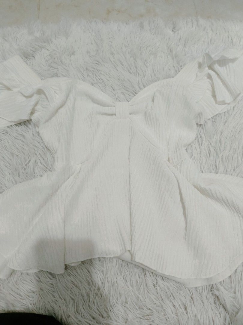 White Off-Shoulder Top (size l - xl) (Category: Blouses) located in Malolos. Submitted by zoefunzy.yyy (Listing ID 1462861471, Image 1). Description: - White off-shoulder top with puff sleeves and a cute bow detail. - Textured fabric for a premium feel. - Comes with a stylish houndstooth vest featuring a button front. - Both pieces are designed for versatility – wear them together or mix and match with other items. - Perfect for layering and crea