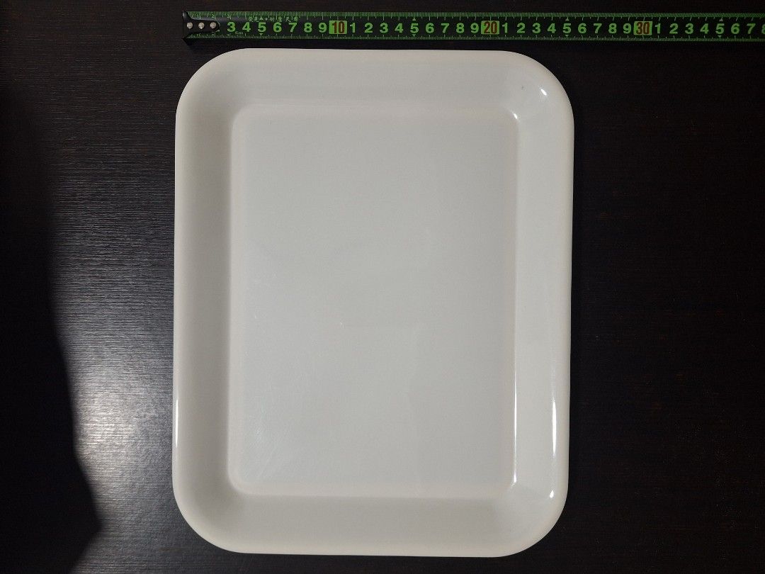White Rectangular Serving Tray (Category: Dinnerware & Cutlery) located in Singapore. Submitted by florinsthon (Listing ID 1462867228, Image 2). Description: - White rectangular tray - Versatile: Use for serving food/drinks or organizing small items - Features a slight lip around the edge - Dimensions: Approx. 32cm x 25cm - Clean and simple design - $10 for 3pcs.