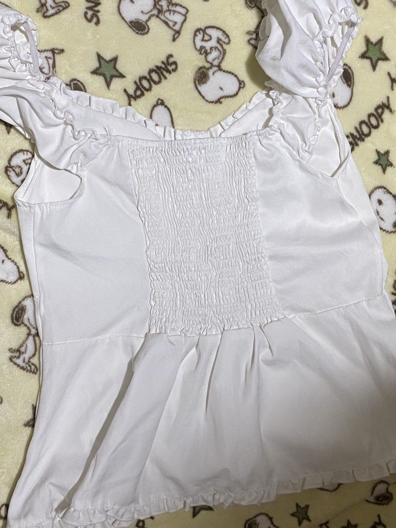 White Ruffle Off-Shoulder Smocked Button-Up Top (Category: Blouses) located in Manila. Submitted by faerikhae (Listing ID 1462861551, Image 2). Description: RFS: don’t fit me well :( bigger on me.