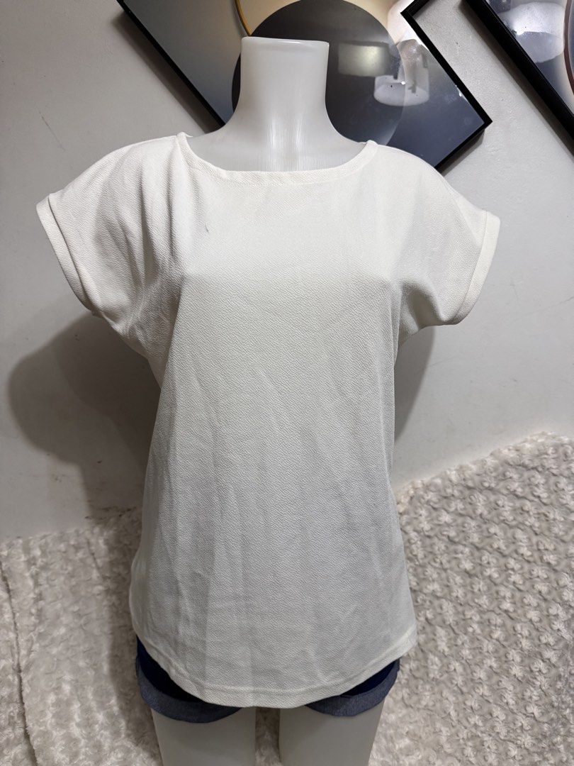 White Textured Cap Sleeve T-shirt (Category: Blouses) located in Marikina City. Submitted by lorradel (Listing ID 1462717921, Image 1). Description: - Simple white t-shirt - Textured fabric for a unique feel - Cap sleeves with a rolled-up detail - Comfortable for everyday wear - Easy to style with jeans or shorts - Ideal for casual outings - MAY HAVE some washable stains (hindi maiiwasan) needs washing; had been stored - mannequin size 34-26-34 -