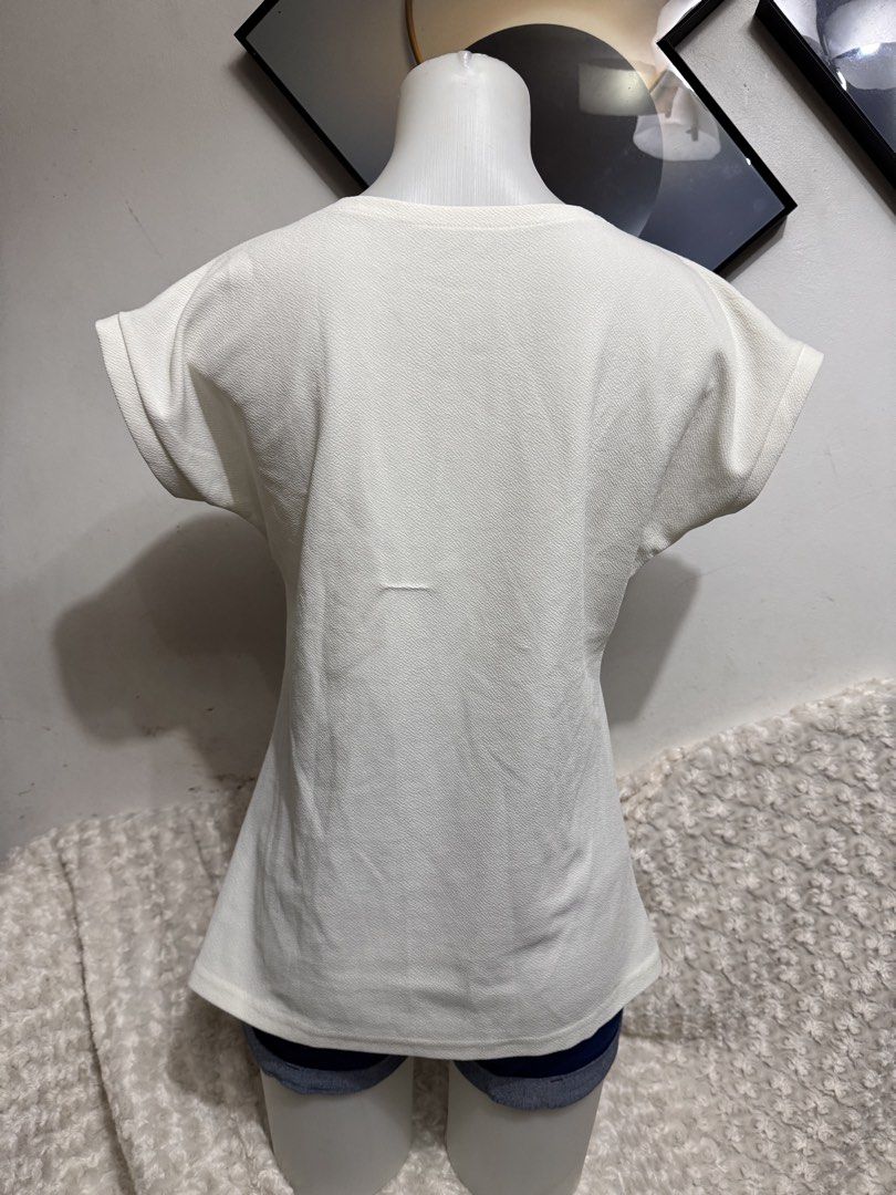 White Textured Cap Sleeve T-shirt (Category: Blouses) located in Marikina City. Submitted by lorradel (Listing ID 1462717921, Image 3). Description: - Simple white t-shirt - Textured fabric for a unique feel - Cap sleeves with a rolled-up detail - Comfortable for everyday wear - Easy to style with jeans or shorts - Ideal for casual outings - MAY HAVE some washable stains (hindi maiiwasan) needs washing; had been stored - mannequin size 34-26-34 -