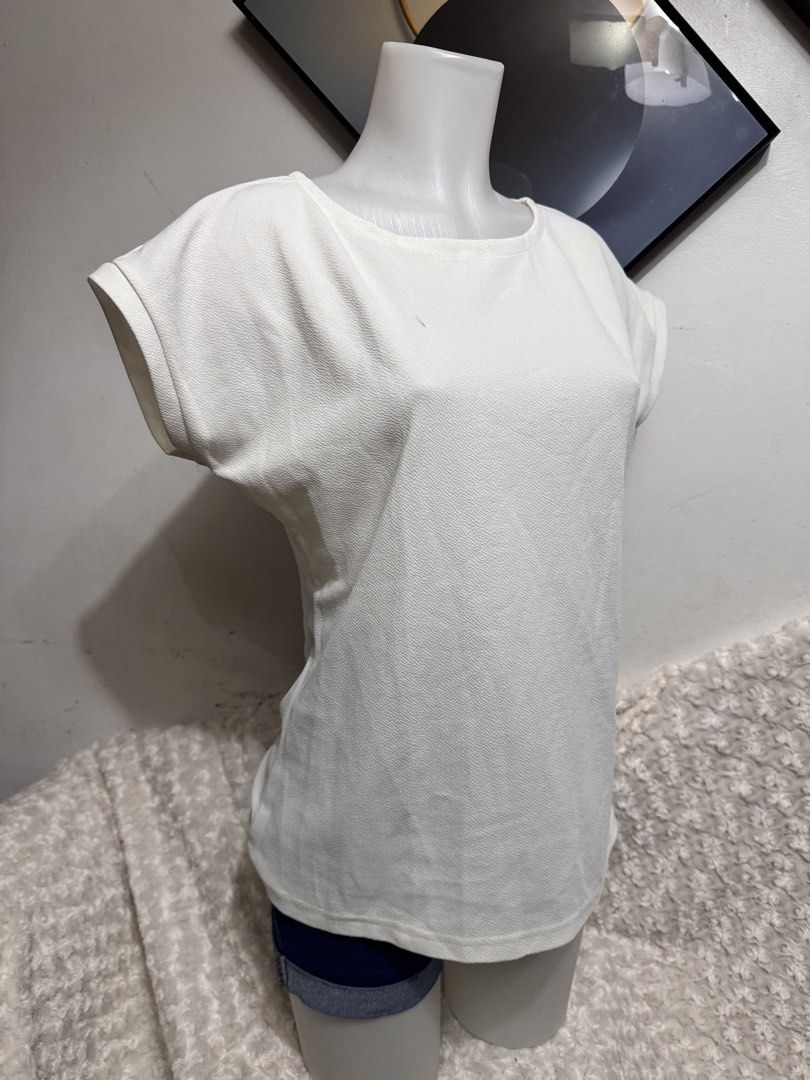 White Textured Cap Sleeve T-shirt (Category: Blouses) located in Marikina City. Submitted by lorradel (Listing ID 1462717921, Image 2). Description: - Simple white t-shirt - Textured fabric for a unique feel - Cap sleeves with a rolled-up detail - Comfortable for everyday wear - Easy to style with jeans or shorts - Ideal for casual outings - MAY HAVE some washable stains (hindi maiiwasan) needs washing; had been stored - mannequin size 34-26-34 -