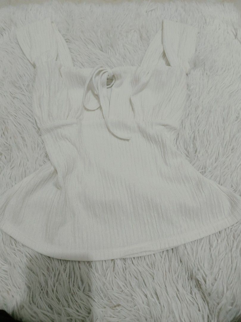 White Textured Tie-Front Square Neck Top (Category: Blouses) located in Malolos. Submitted by zoefunzy.yyy (Listing ID 1462861205, Image 1). Description: - White textured top - Tie-front detail - Square neckline - Puff sleeves - Flattering peplum hem - Perfect for dressing up or down - Easy to pair with jeans or skirts.