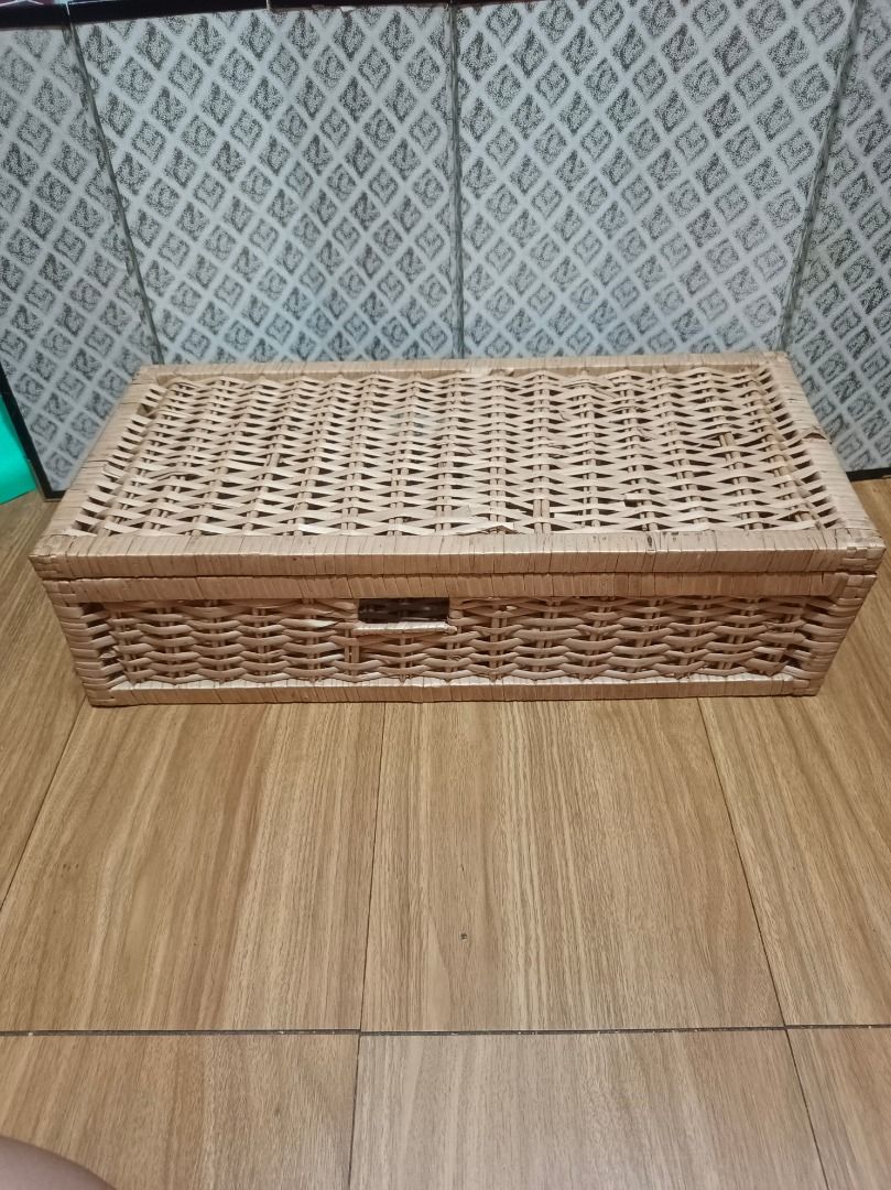 Wicker Storage Box with Lid (Category: Storage Boxes & Baskets) located in Makati City. Submitted by nyxhemera26 (Listing ID 1462877640, Image 1). Description: Wicker Storage Box with Lid - With minimal flaws on the lid. Please see photos - Woven wicker storage box - Features a hinged lid - Ideal for organizing and decluttering any space - Approximate dimensions: 21 inches (Length) x 12 inches (Width) x 9 inches (Height) - Made from natural woven
