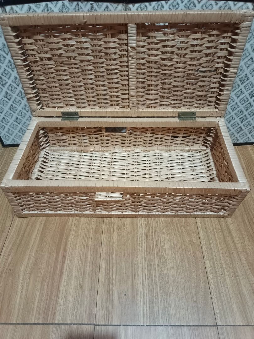 Wicker Storage Box with Lid (Category: Storage Boxes & Baskets) located in Makati City. Submitted by nyxhemera26 (Listing ID 1462877640, Image 2). Description: Wicker Storage Box with Lid - With minimal flaws on the lid. Please see photos - Woven wicker storage box - Features a hinged lid - Ideal for organizing and decluttering any space - Approximate dimensions: 21 inches (Length) x 12 inches (Width) x 9 inches (Height) - Made from natural woven