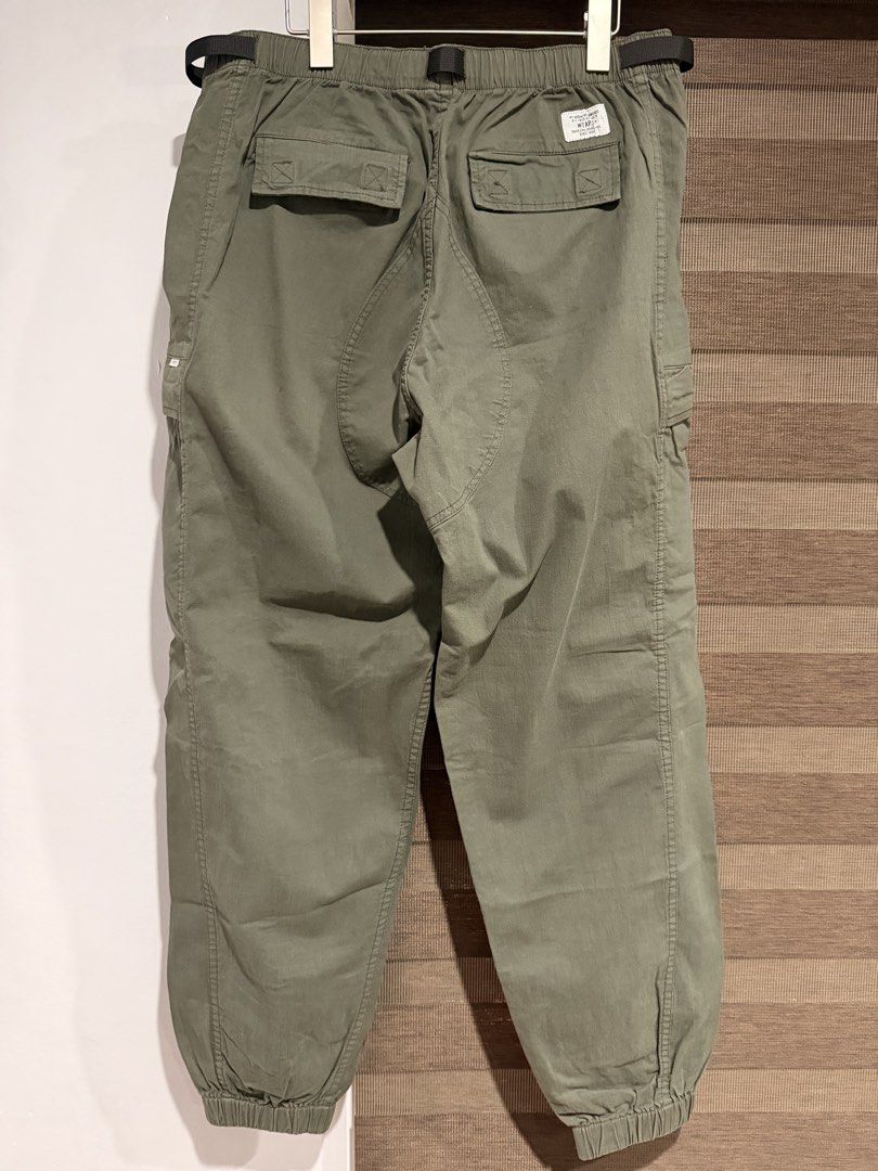 WTAPS Cargo Pants Olive Green Belted Jogger Style (Category: Joggers) located in Manila. Submitted by furugi24 (Listing ID 1462777047, Image 2). Description: - Brand: WTAPS - Color: Olive Green - Style: Cargo Jogger Pants - Dimension WAIST: 32-36 inches (adjustable) Length: 39 inches SRP : 1500 - Features: Elasticated cuffs, built-in adjustable belt with quick-release buckle, multiple storage pockets .
