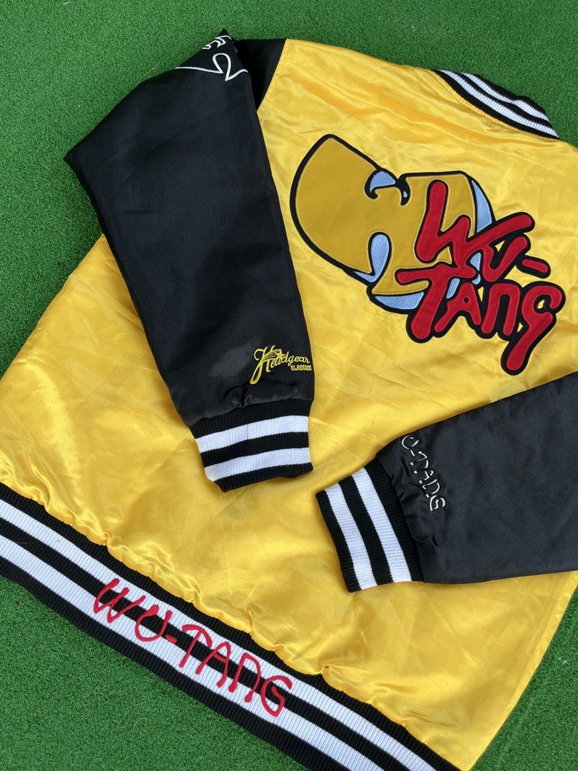 Wu-Tang Bomber jacket (Category: Coats, Jackets and Outerwear) located in Cagayan de Oro. Submitted by charlessober (Listing ID 1462774291, Image 3). Description: - Iconic Wu-Tang Clan varsity jacket - Classic yellow body with black sleeves - Features Wu-Tang logo and 'Cream' graphic on the front - Large Wu-Tang logo prominently displayed on the back - Comfortable ribbed collar, cuffs, and hem - A must-have for any Wu-Tang fan!.