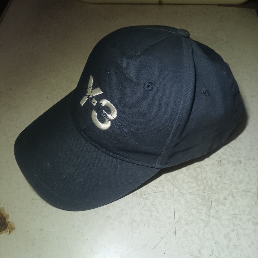 Y-3 Signature In Navy Blue (Category: Caps & Hats) located in Manila. Submitted by itsnik444 (Listing ID 1462873568, Image 2). Description: Mode of Payments: •GCASH Courier: • LALAMOVE ( Same day Delivery) • J&T EXPRESS • LBC ❗️ Product color may slightly vary due to photographic ❗️ DISCLAIMER: We are not associated or affiliated with any brand posted.