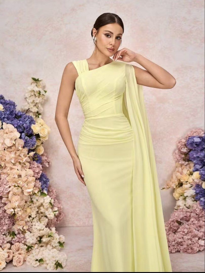 Yellow bridesmaid gown (Category: Evening dresses & gowns) located in Manila. Submitted by _preciousfinds.2 (Listing ID 1462718420, Image 1). Description: - Flowy yellow gown - Elegant one-shoulder design - Draped cape detail on one side - Flattering ruching at the waist - Floor-length silhouette - Ideal for formal events and parties - Security tag included.