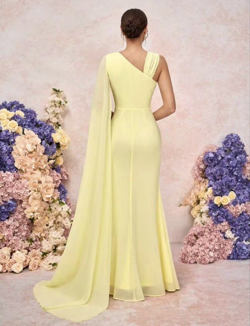 Yellow bridesmaid gown (Category: Evening dresses & gowns) located in Manila. Submitted by _preciousfinds.2 (Listing ID 1462718420, Image 3). Description: - Flowy yellow gown - Elegant one-shoulder design - Draped cape detail on one side - Flattering ruching at the waist - Floor-length silhouette - Ideal for formal events and parties - Security tag included.