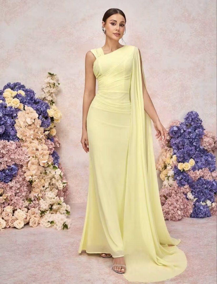 Yellow bridesmaid gown (Category: Evening dresses & gowns) located in Manila. Submitted by _preciousfinds.2 (Listing ID 1462718420, Image 2). Description: - Flowy yellow gown - Elegant one-shoulder design - Draped cape detail on one side - Flattering ruching at the waist - Floor-length silhouette - Ideal for formal events and parties - Security tag included.