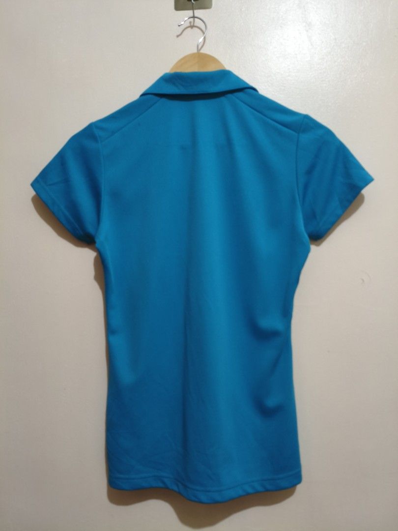 Yonex Turquoise Drifit Polo Shirt (Category: Blouses) located in Mandaluyong City. Submitted by frivsthriftsph (Listing ID 1462770595, Image 2). Description: Yonex Turquoise Drifit Polo Shirt Size M on tag. Actual dimes are 16W by 24L. Like new condition. Color rate is 10/10. No issue..