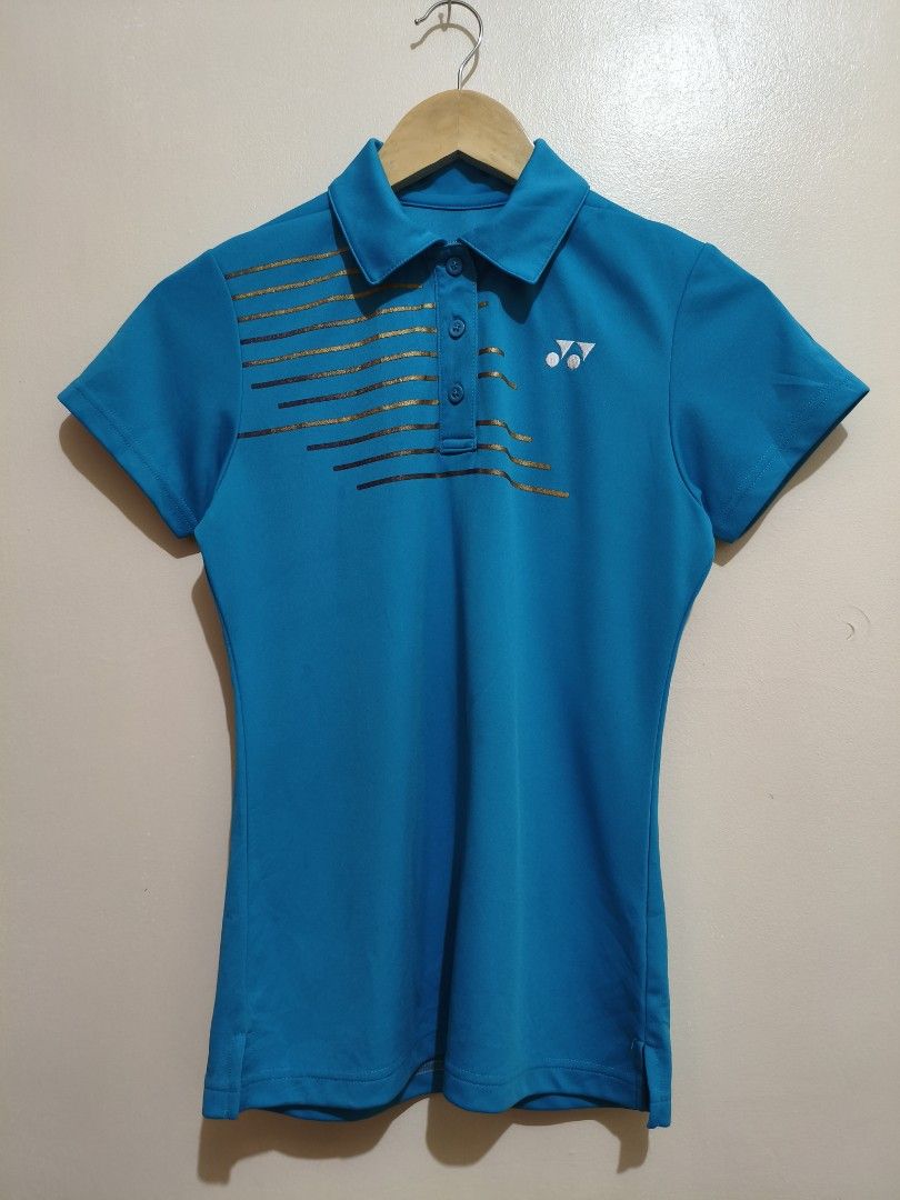Yonex Turquoise Drifit Polo Shirt (Category: Blouses) located in Mandaluyong City. Submitted by frivsthriftsph (Listing ID 1462770595, Image 1). Description: Yonex Turquoise Drifit Polo Shirt Size M on tag. Actual dimes are 16W by 24L. Like new condition. Color rate is 10/10. No issue..
