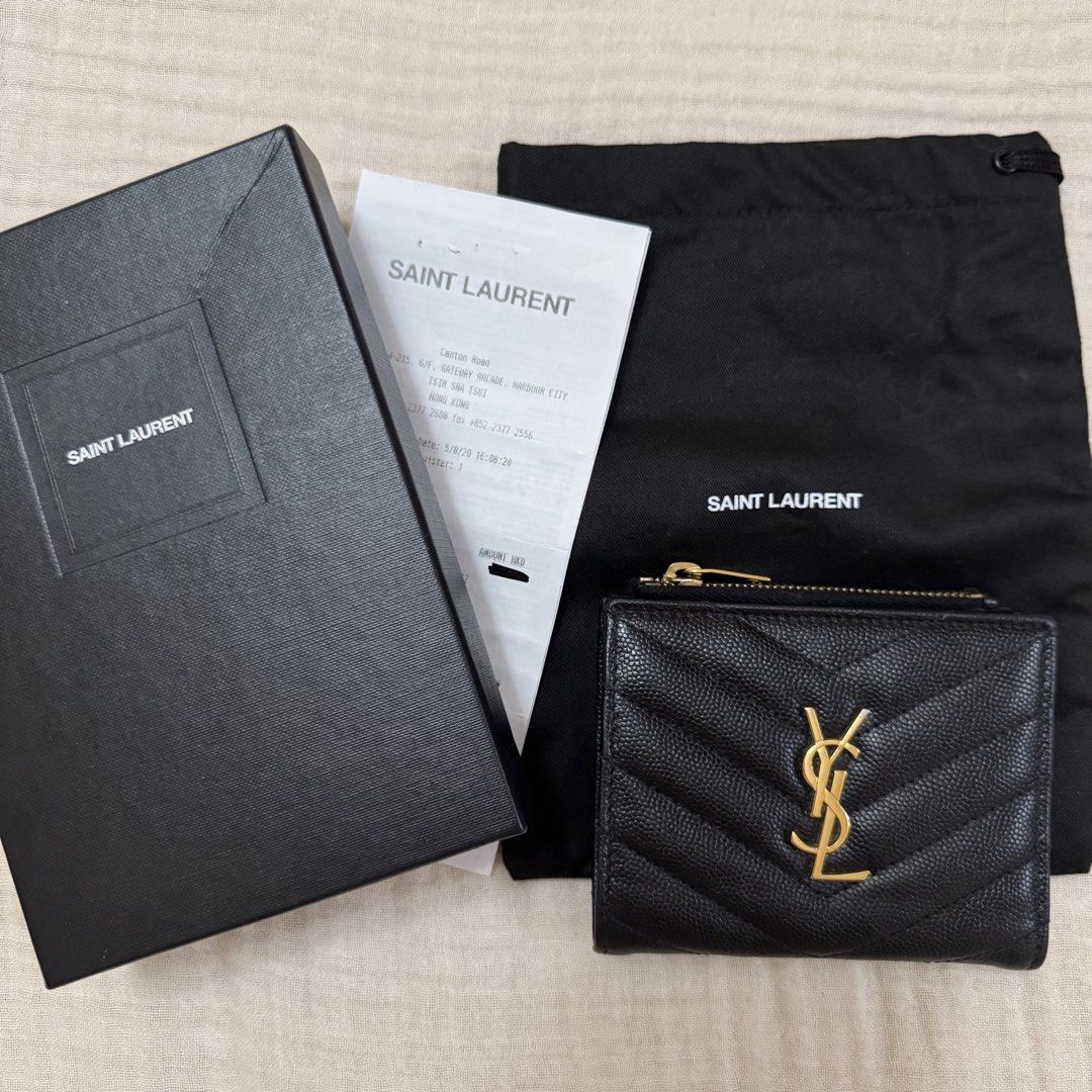 YSL Bi-Fold Wallet (Category: Luxury Bags & Wallets) located in Quezon City. Submitted by wanderingpenguin (Listing ID 1462865823, Image 1). Description: YSL wallet Well taken care of Guaranteed authentic Complete with receipt, dust bag, and box No chipping in the leather & lining Issue: Gold fading in some areas as seen on photos Measurements & other details seen on last photo Can send more photos upon request.