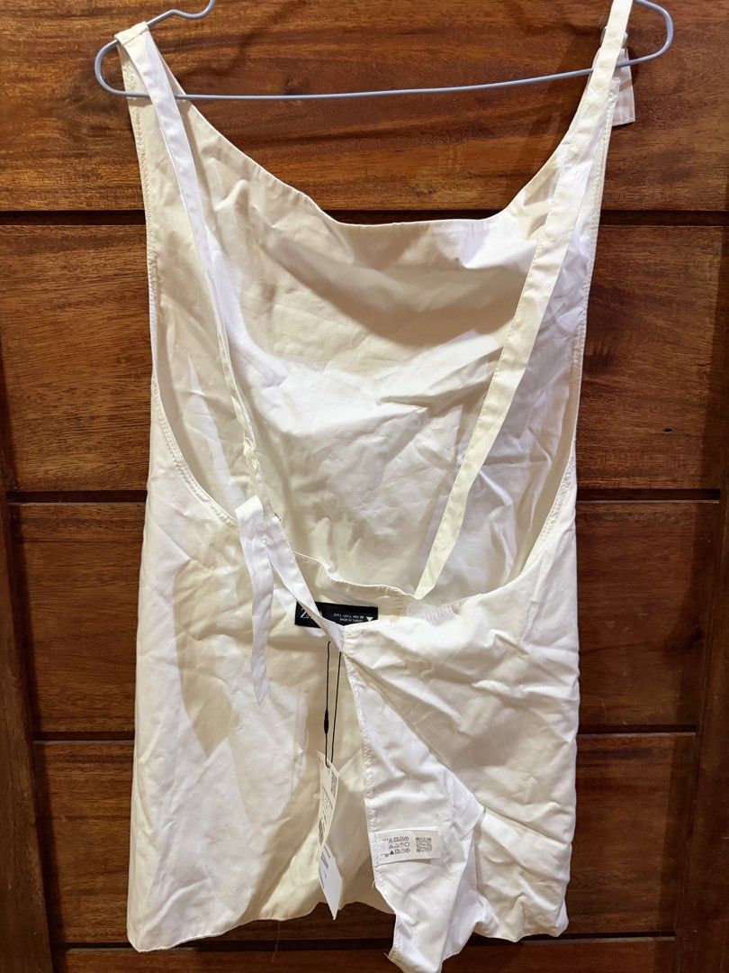 ZARA BACKLESS TANK TOP SELF TIE WHITE (Category: Sleeveless) located in Makati City. Submitted by inxdnl (Listing ID 1462711437, Image 2). Description: IN GOOD CONDITION HAVE NOT YET WORN WASHED ALREADY NO DAMAGE CAN SEND MEASUREMENTS CAN GIVE DISCOUNT .
