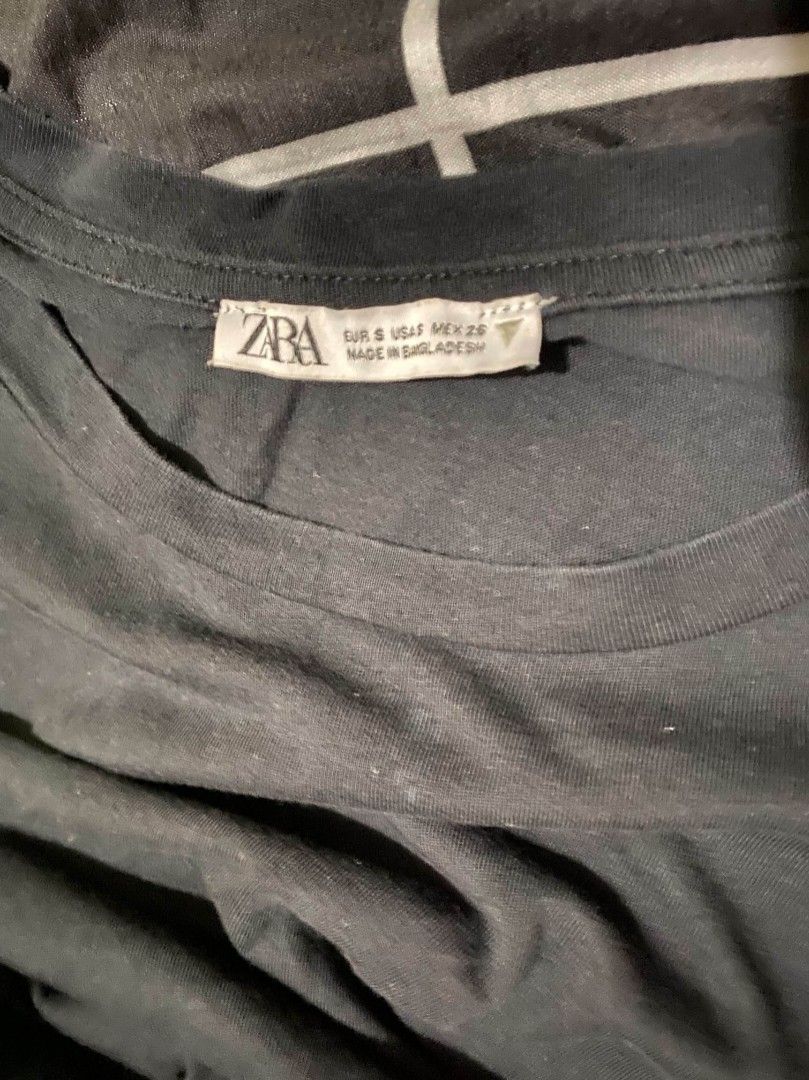 Zara Black Ruffle Sleeve Top (Category: Others Tops) located in Binan City. Submitted by katespanie (Listing ID 1462793440, Image 2). Description: Pre-loved Zara ruffle top. Maayos pa naman at pwedeng-pwede pang-gala, pero may kaunting normal signs of washing at light fading na sa kulay black nito dahil nagamit na rin nang ilang beses. Walang butas o malaking mantsa, pero bawal po sa maselan o maarte..