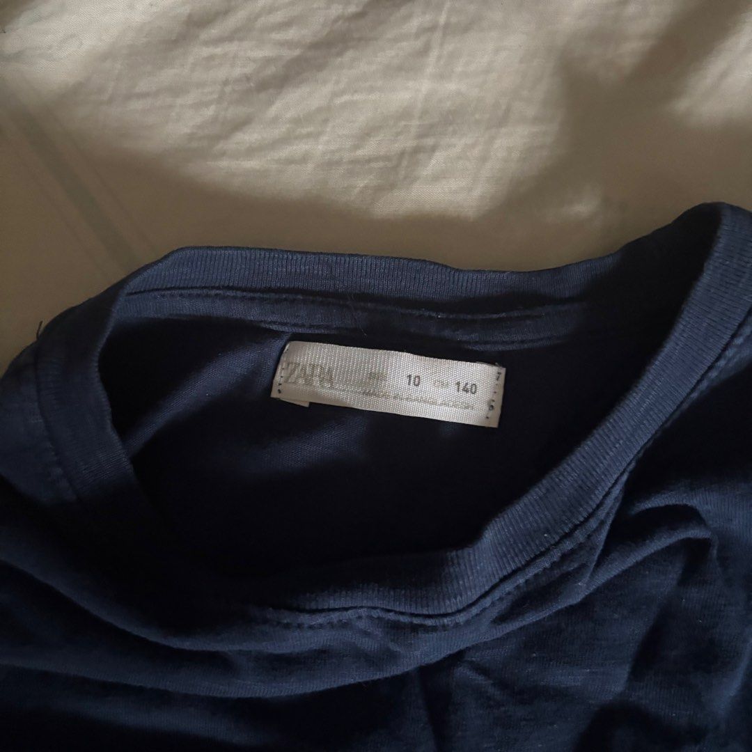 Zara Navy Blue Crew Neck Longsleeve (Category: Longsleeves) located in Binan City. Submitted by myprelovedhaul (Listing ID 1462805967, Image 3). Description: Fits xs to medium adult! The highlighted product is a plain navy blue long-sleeve crewneck t-shirt from Zara Kids..