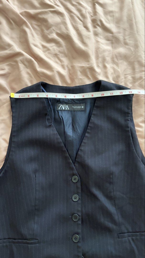 Zara Pinstripe Vest (Category: Sleeveless) located in Taguig. Submitted by ellezzzzz (Listing ID 1462695513, Image 3). Description: - Classic Zara pinstripe vest - V-neckline with button closure - Two functional front pockets - Fully lined for a polished look - Ideal for layering over shirts or dresses - Measurements available in photos.